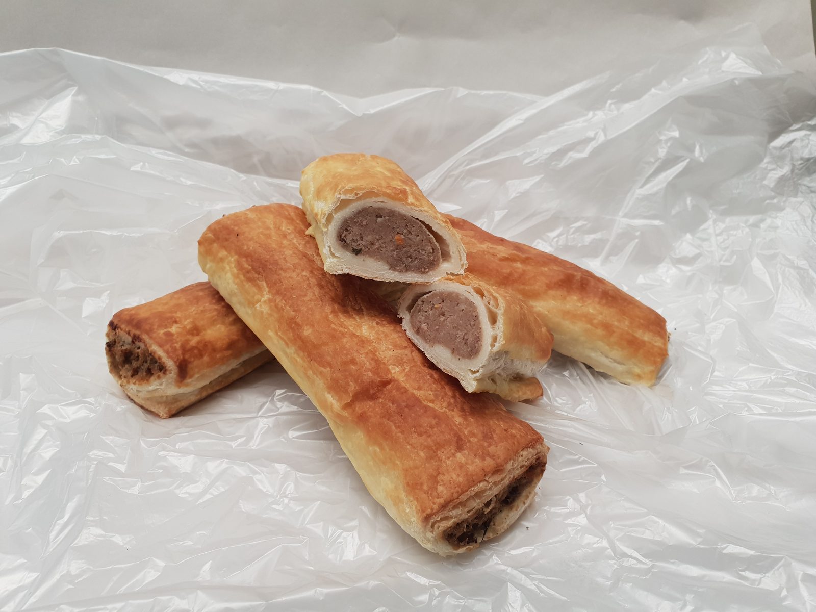 Simply Pies hand-rolled sausage rolls with flaky golden pastry