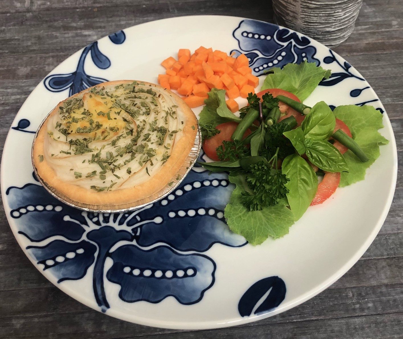 Simply Pies Smart Choices school option pie with herb topping served with a fresh salad